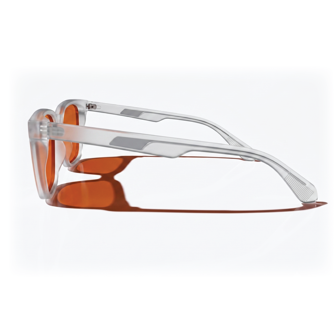 Side view of square-framed sunglasses with translucent clear frames and orange-tinted lenses, shown on a clean white background.