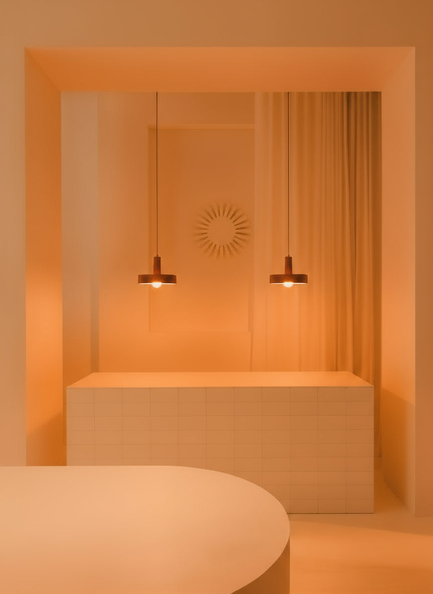 Modern interior with a mirror, light fixture, and minimal decor.