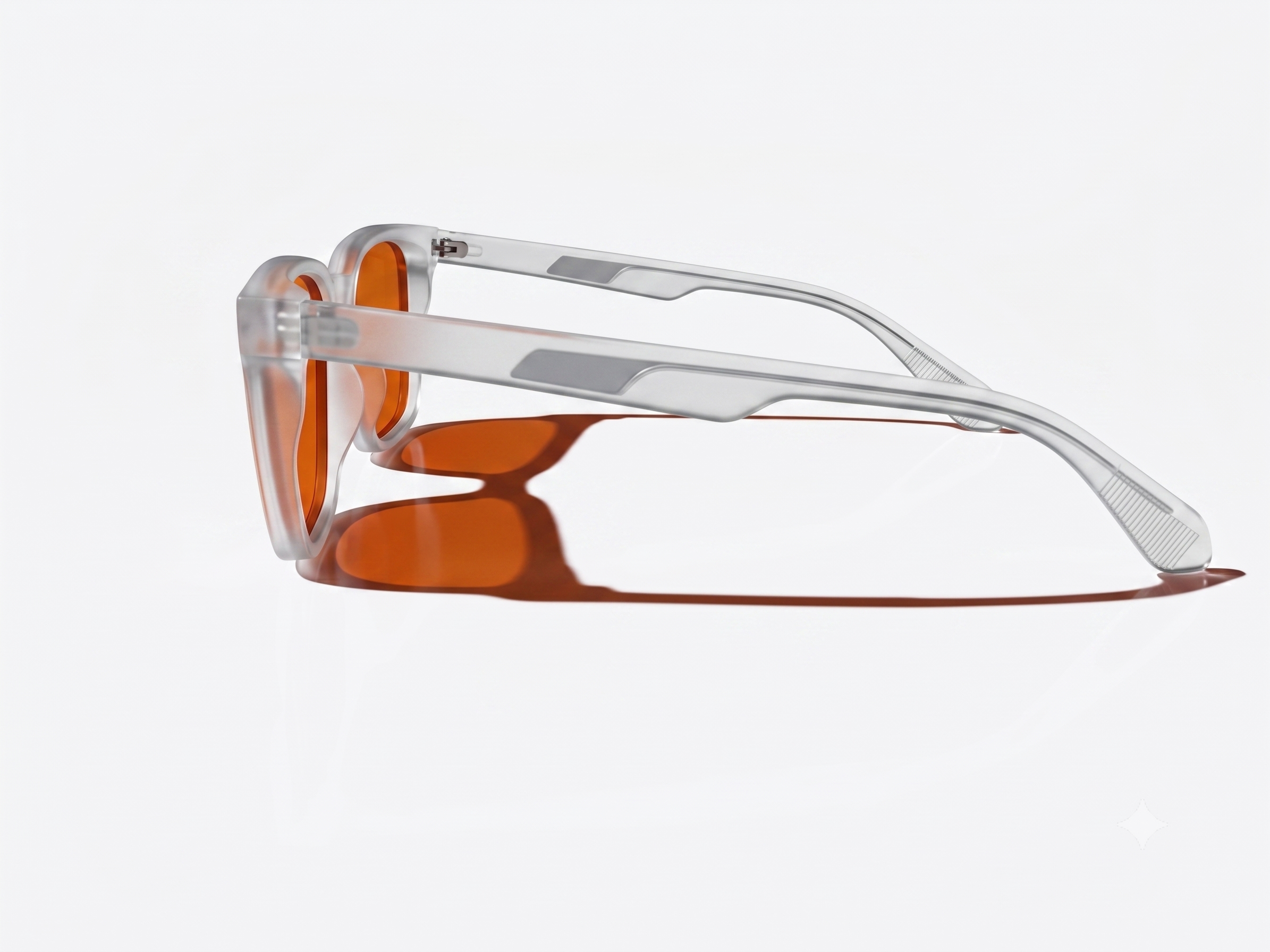 Side view of square-framed sunglasses with translucent clear frames and orange-tinted lenses, shown on a clean white background.